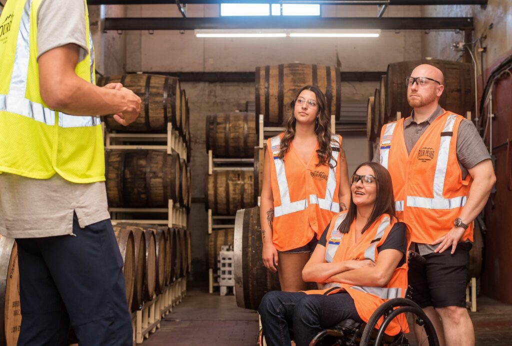 man-giving-a-tour-of-a-brewery-3009799