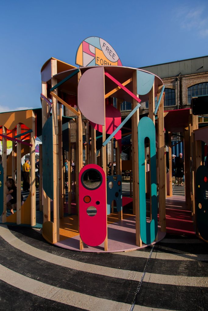Colourful wooden structure with open sides that children can enter and explore